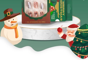 Christmas press-on nails set with silver glitter and reindeer patterns in festive packaging