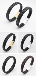 Detailed view of woven leather bracelets in black and brown with magnetic metal clasps