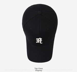 Close-up of gothic R letter embroidery and fine cotton twill texture on a black cap