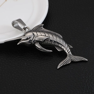 Macro shot of silver swordfish pendant in polished stainless steel with detailed fins