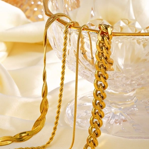 18K gold plated stainless steel jewelry set featuring Cuban, snake, and rope chain bracelets