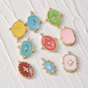 Collection of 14k gold plated stainless steel evil eye pendants in colorful enamel