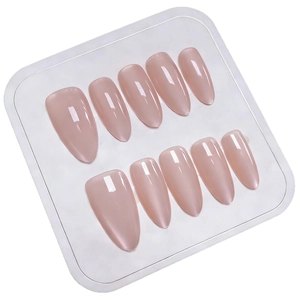 Glossy nude pink almond press-on nails set displayed on a clean white tray