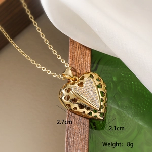 Detail showing 2.7cm x 2.1cm heart pendant with weight 8g on 18k gold plated necklace