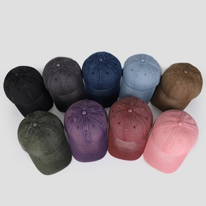 Detailed grid view of washed denim baseball caps in nine assorted vintage colors