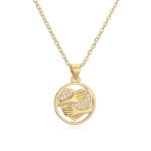 Gold star and moon necklace with heart shaped crystal pendant and circle design