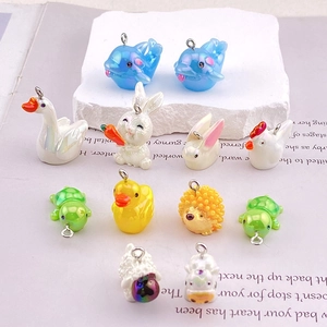 Colorful resin animal charms including dolphin, rabbit, and swan for DIY jewelry making
