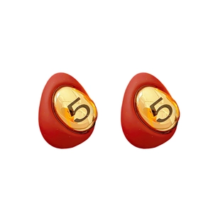 Red enamel teardrop earrings with gold number five pendant on white background