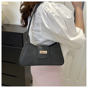 Side view of black matte underarm bag with square metal buckle on shoulder strap