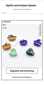 Set of 6 Halloween hair claws featuring colorful glowing pumpkin and ghost designs