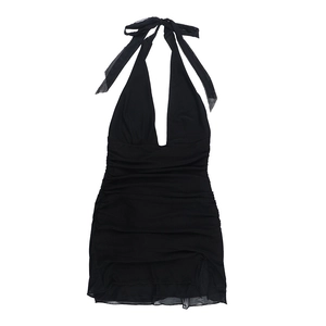 Detail of ruched black halter dress showing deep V-neck and shiny textured fabric