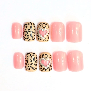 Short square press-on nails with dark leopard print, pink jelly finish and heart rhinestones