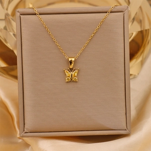 Detail of 18K gold-plated butterfly pendant featuring a large yellow zircon stone