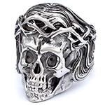 Macro detail of gothic skull ring with crown of thorns in vintage silver finish