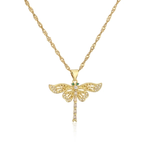 Detailed view of gold dragonfly pendant with green and clear zircon stones on chain