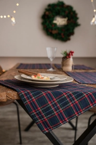 Classic red and green plaid Christmas table runner and placemat set for festive dining