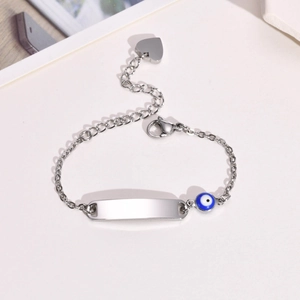 Gold stainless steel bracelet with blank bar, blue evil eye bead and heart charm