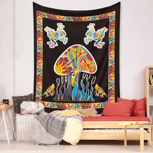 Detailed view of bohemian mushroom tapestry with psychedelic totems on a black background