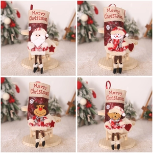 Set of four plush Christmas stockings with 3D Santa and reindeer for festive tree decor