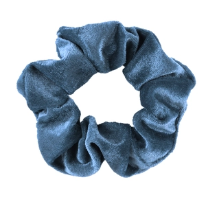 Detailed view of the dark blue velvet scrunchie showing soft texture and pleated design