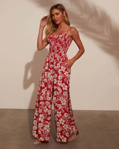 Detail of red floral print romper with spaghetti straps and wide-leg cut for summer