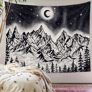 Detailed texture of black and white mountain tapestry hanging on a cozy bedroom wall