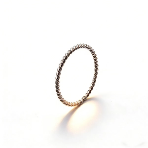 Macro detail of silver twisted rope ring with high-polished stainless steel finish