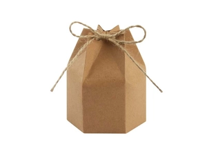 Detailed view of a hexagonal kraft paper gift box with decorative jute twine and paper texture