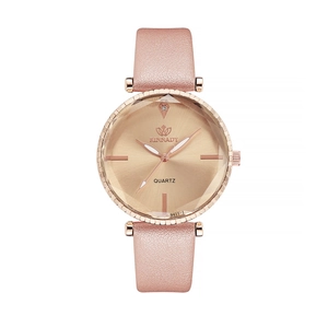 Close-up of pink glitter strap and rose gold rhinestone case on quartz fashion watch