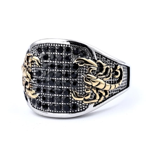 Men's silver steel ring with gold scorpion relief and black multifaceted gemstones