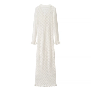 Elegant white knit long sleeve V-neck dress featuring hollow diamond patterns and ruffles