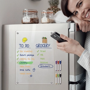 Detailed view of magnetic acrylic weekly planner on fridge with six colorful dry erase markers