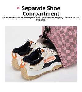 Close-up view of the separate shoe compartment feature on a pink checkered travel bag