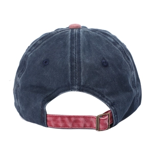 Detail view of washed cotton baseball cap with adjustable antique brass metal buckle