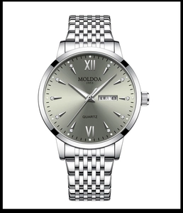 Detail of quartz watch dial with dual calendar, roman numerals and rhinestone indices