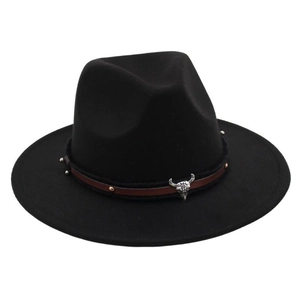 Detail of black fedora hat featuring a brown leather band with a silver bull skull buckle