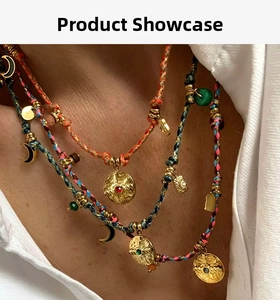 Detail of bohemian layered necklace with colorful woven ropes and vintage gold pendants