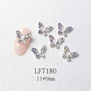 Detailed view of 11x9mm silver metal butterfly nail art charm with colorful crystals