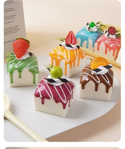 Macro detail of six colorful PU squishy cream cake models with realistic fruit toppings