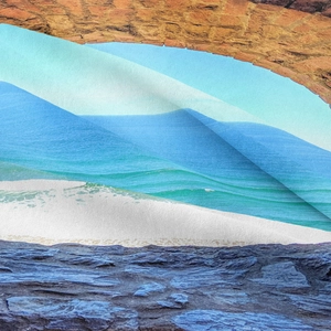 Close-up of bohemian tapestry with blue and green wave patterns between stone textures
