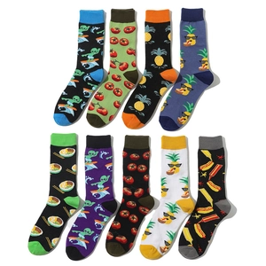 Flat lay of colorful cotton crew socks featuring funny fruit and cartoon food patterns
