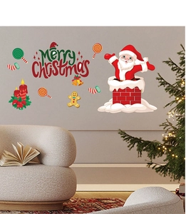 Festive Santa and gingerbread PVC wall sticker set displayed on a living room wall