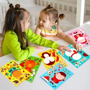 Kids playing with DIY Christmas Santa and snowman puzzle stickers on a white desk