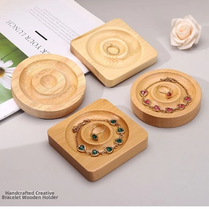 Detail of round and square solid wood jewelry trays for bracelet and ring display