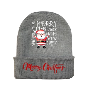 Detailed close-up of grey knitted beanie with Merry Christmas text and Santa Claus print