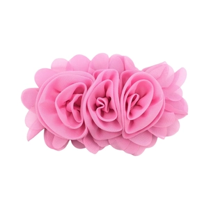 Detailed close-up of three pink chiffon fabric rose flowers for children's hair accessories