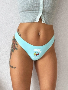 Macro shot of light blue cotton thong featuring cherry print and LIKE cherry BOMB text