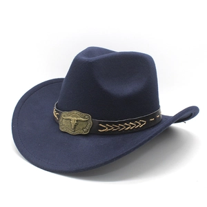 Detail of navy blue felt cowboy hat featuring a leather band and metal bull skull buckle