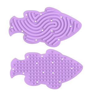 Macro detail of purple fish-shaped silicone sensory board with maze and bumpy textures