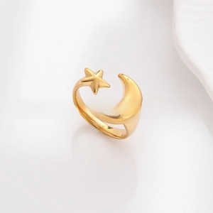 Detail of 18k gold plated stainless steel open ring with crescent moon and star motifs